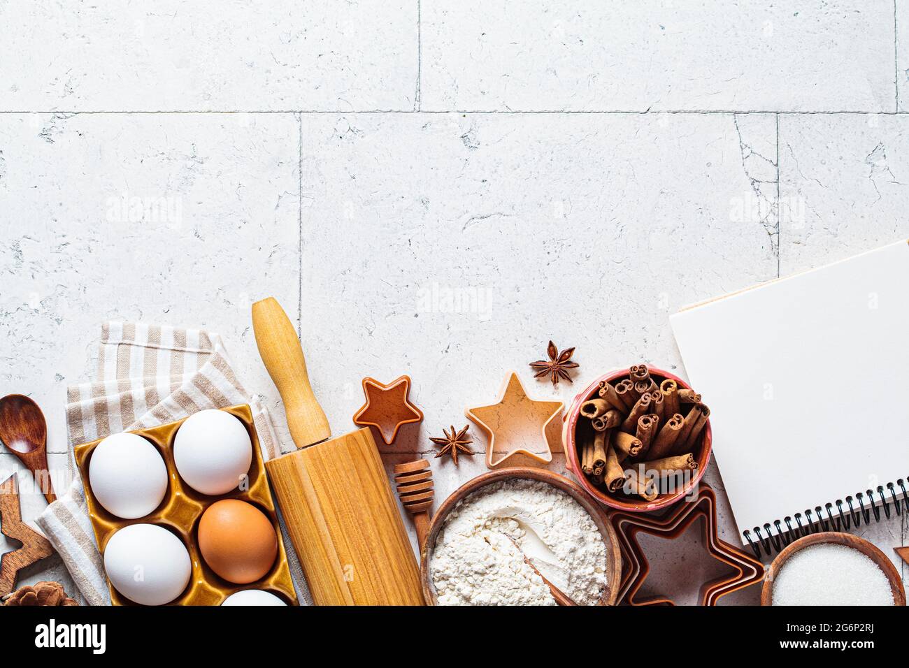 https://c8.alamy.com/comp/2G6P2RJ/christmas-cooking-concept-ingredients-for-christmas-cookies-on-gray-tiles-background-copy-space-flour-eggs-sugar-cinnamon-top-view-2G6P2RJ.jpg
