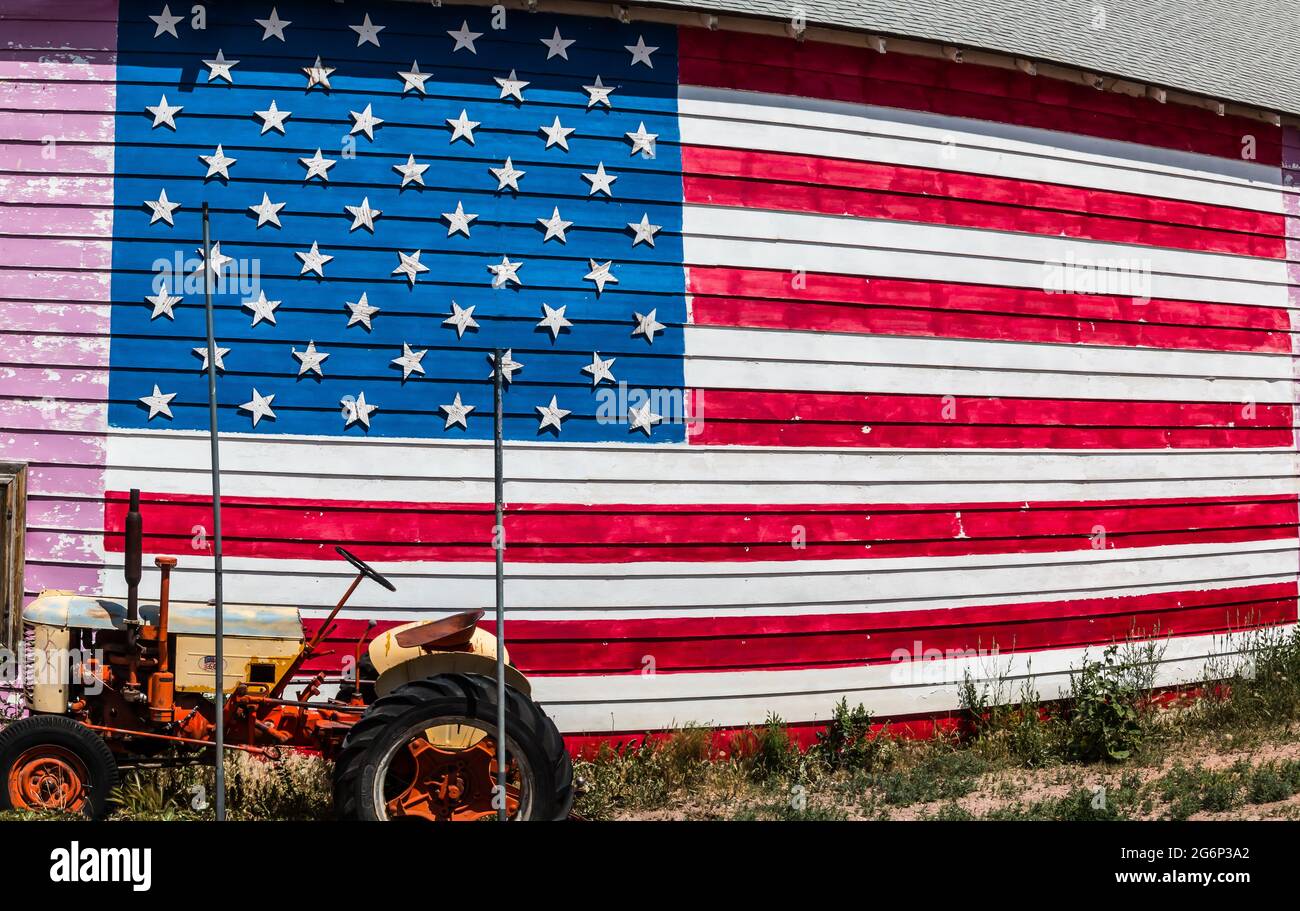 American Flag Painted on a Barn With a  Farm Tractor, Seligman, Arizona, USA Stock Photo