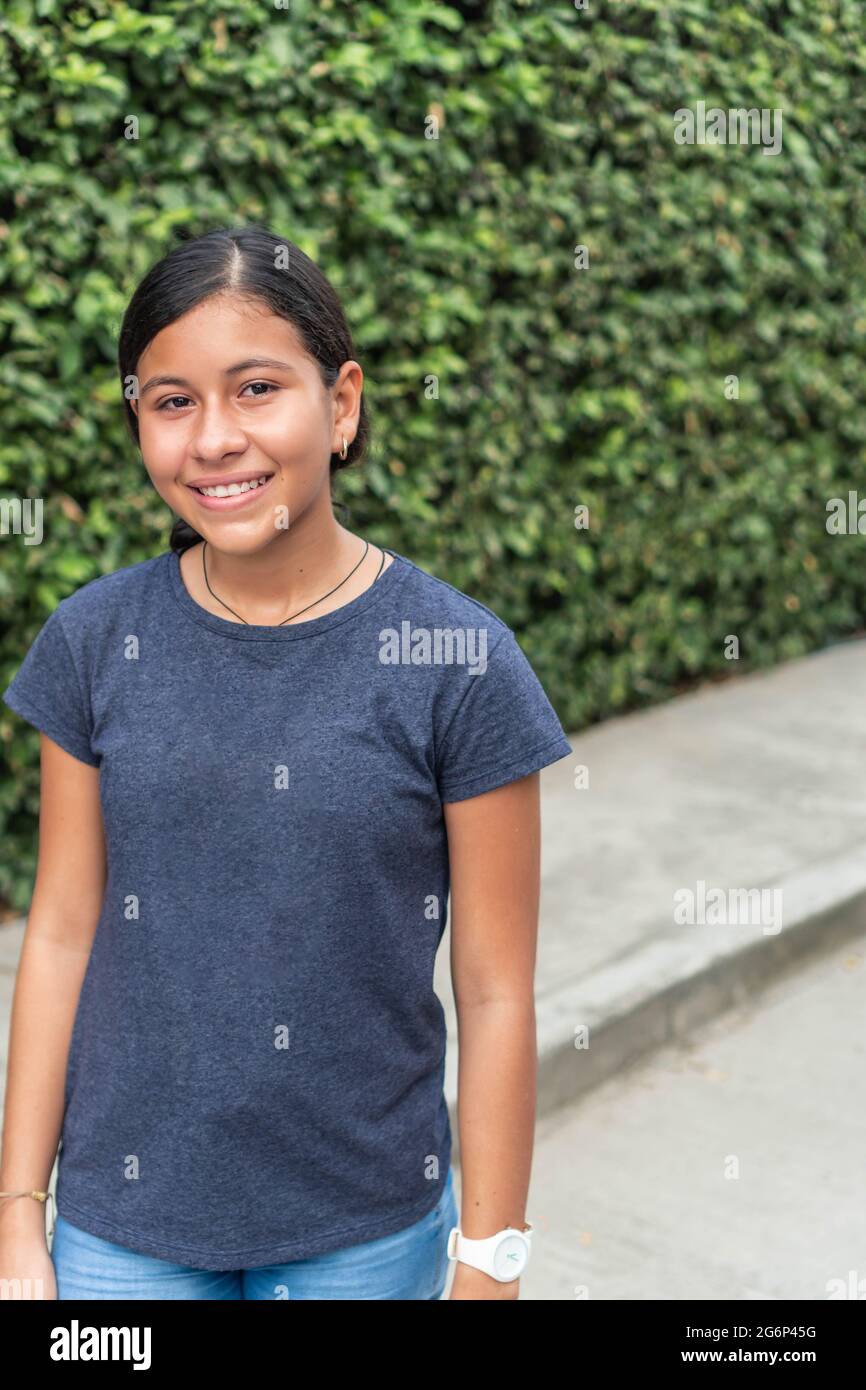 Portrait of a teenage girl smiling outdoors Stock Photo - Alamy