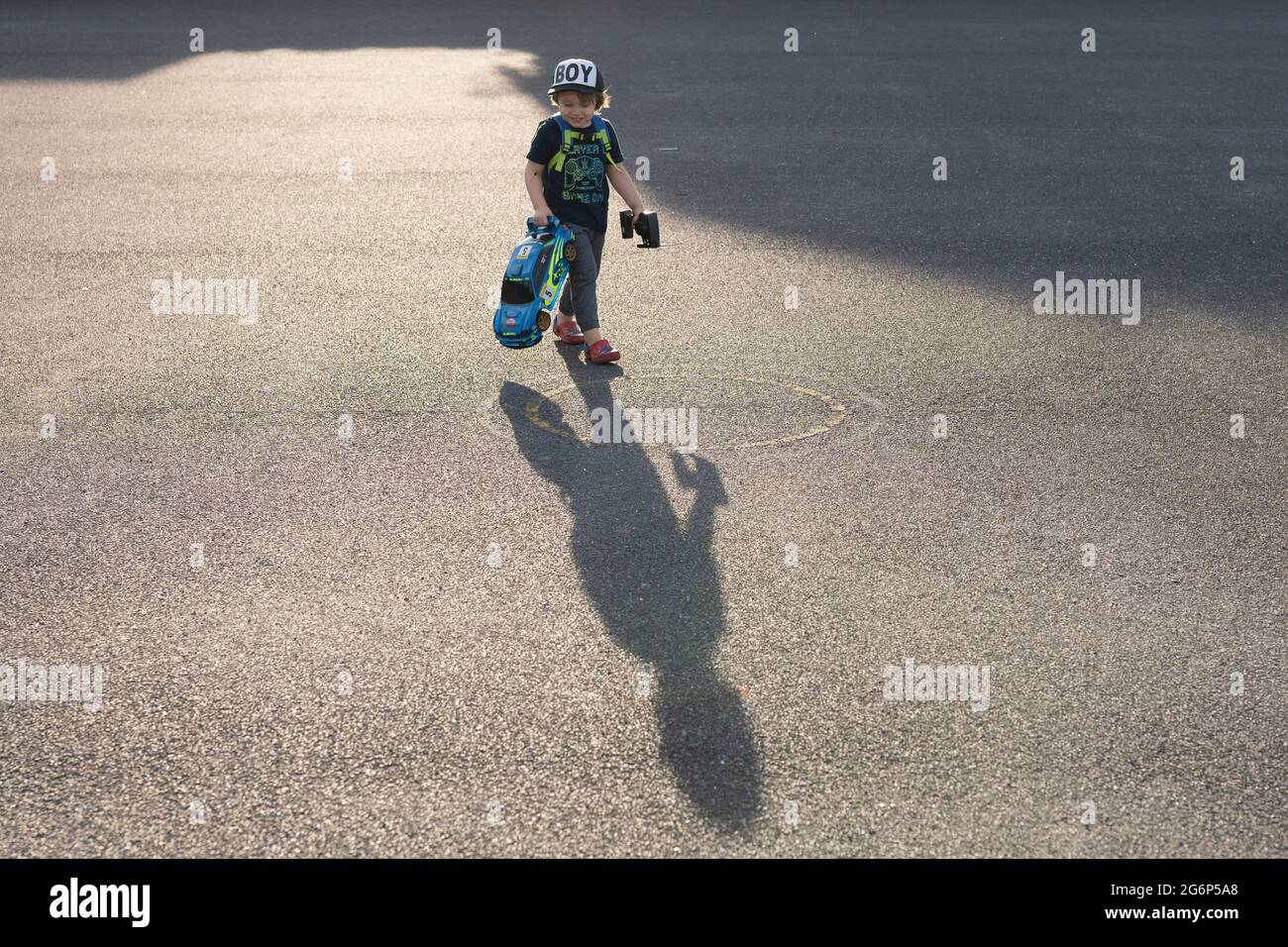 A child playing with a radio control car Stock Photo