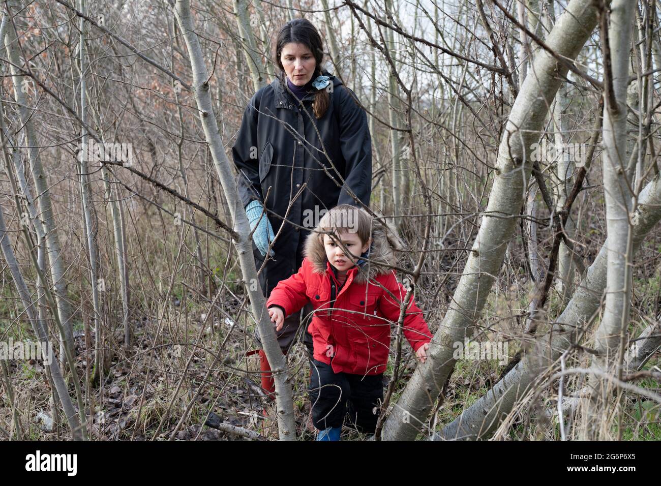 A mother and a son walking in Wanstead Flats in East London Stock Photo
