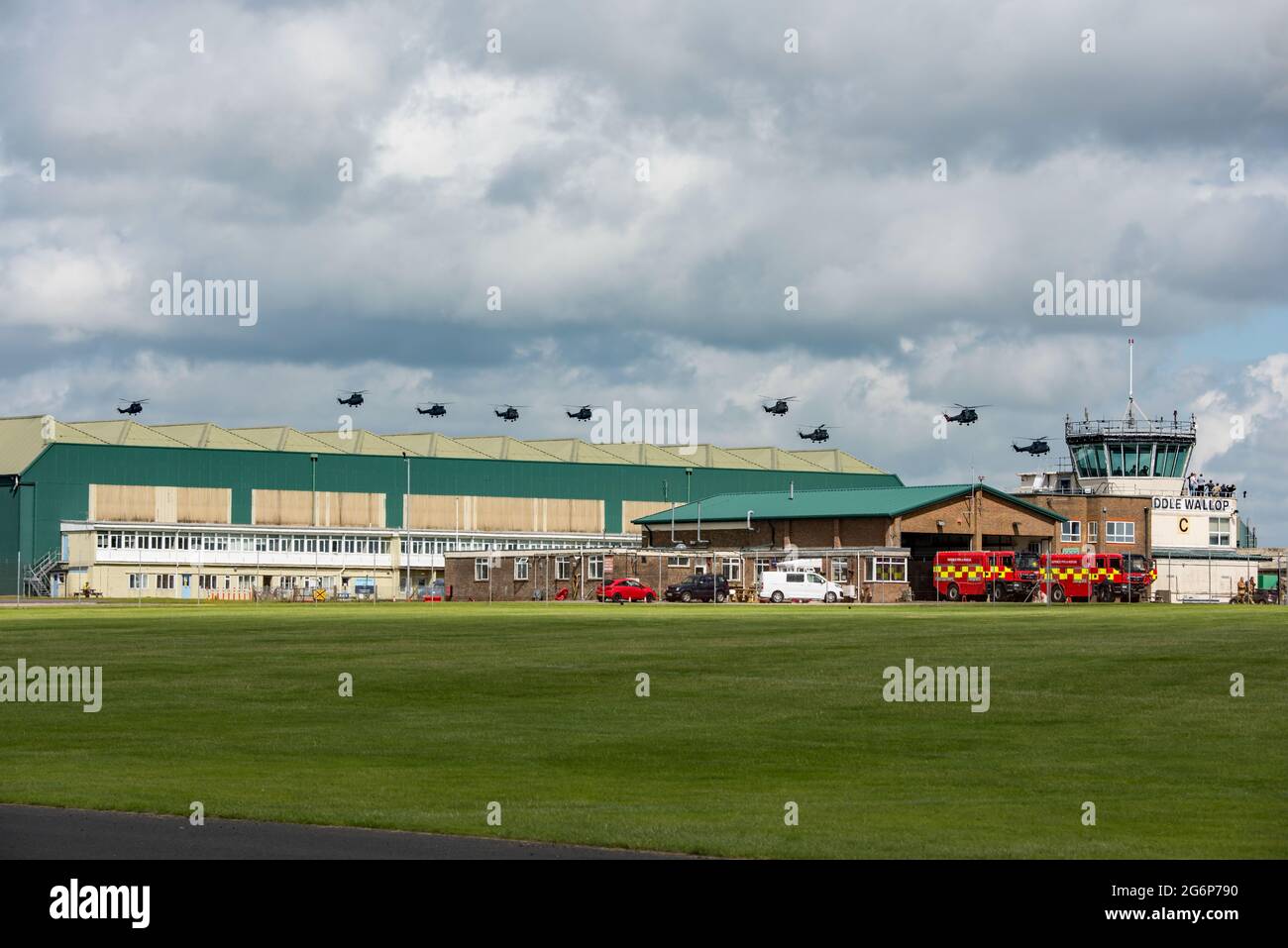 Nine RAF Puma helicopters about to land at AAC Middle Wallop, Hants during their 50th Anniversary flying tour of the UK on the 7th July 2021. Stock Photo