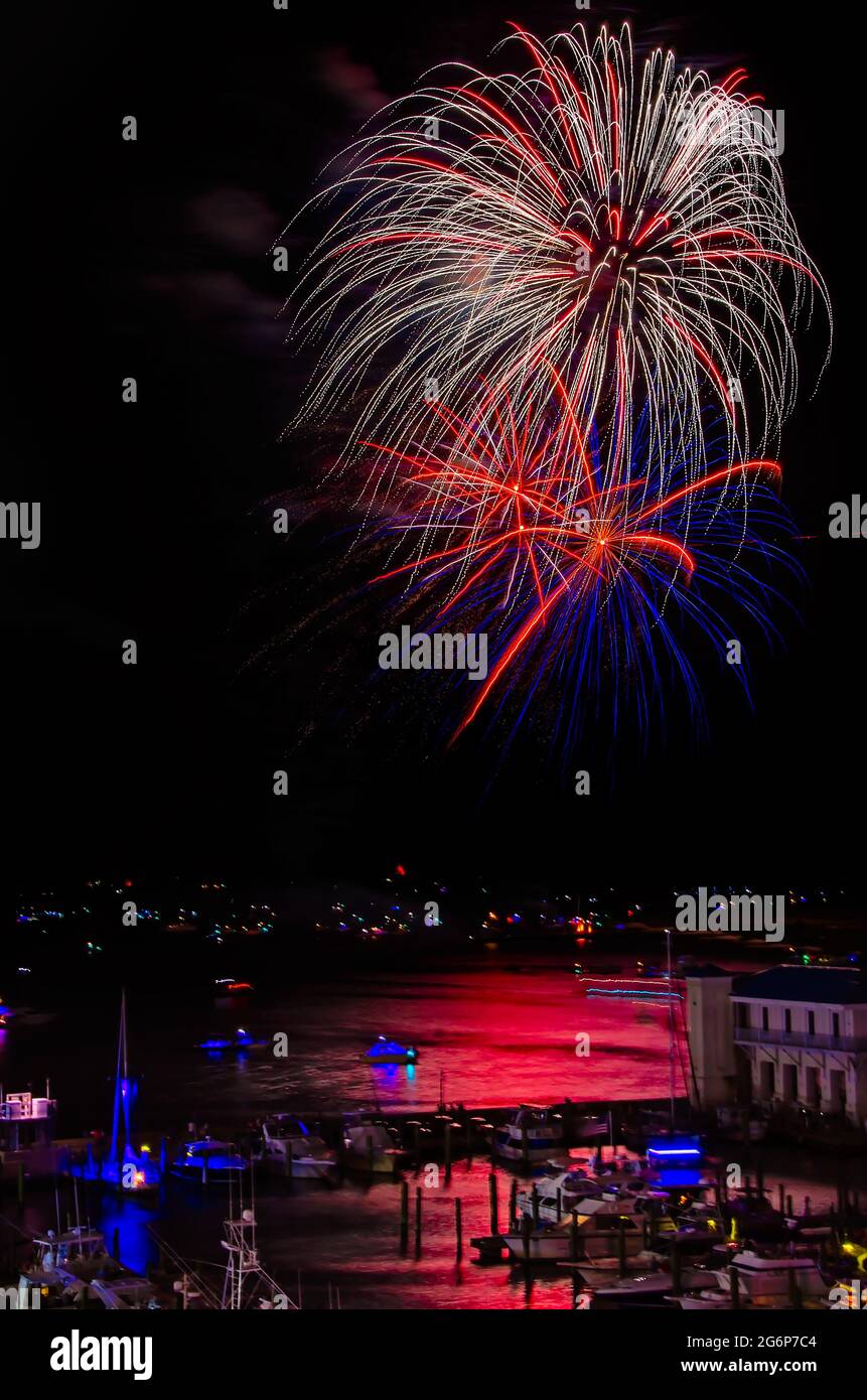 Fireworks explode over Biloxi Bay on the Fourth of July, July 4, 2021