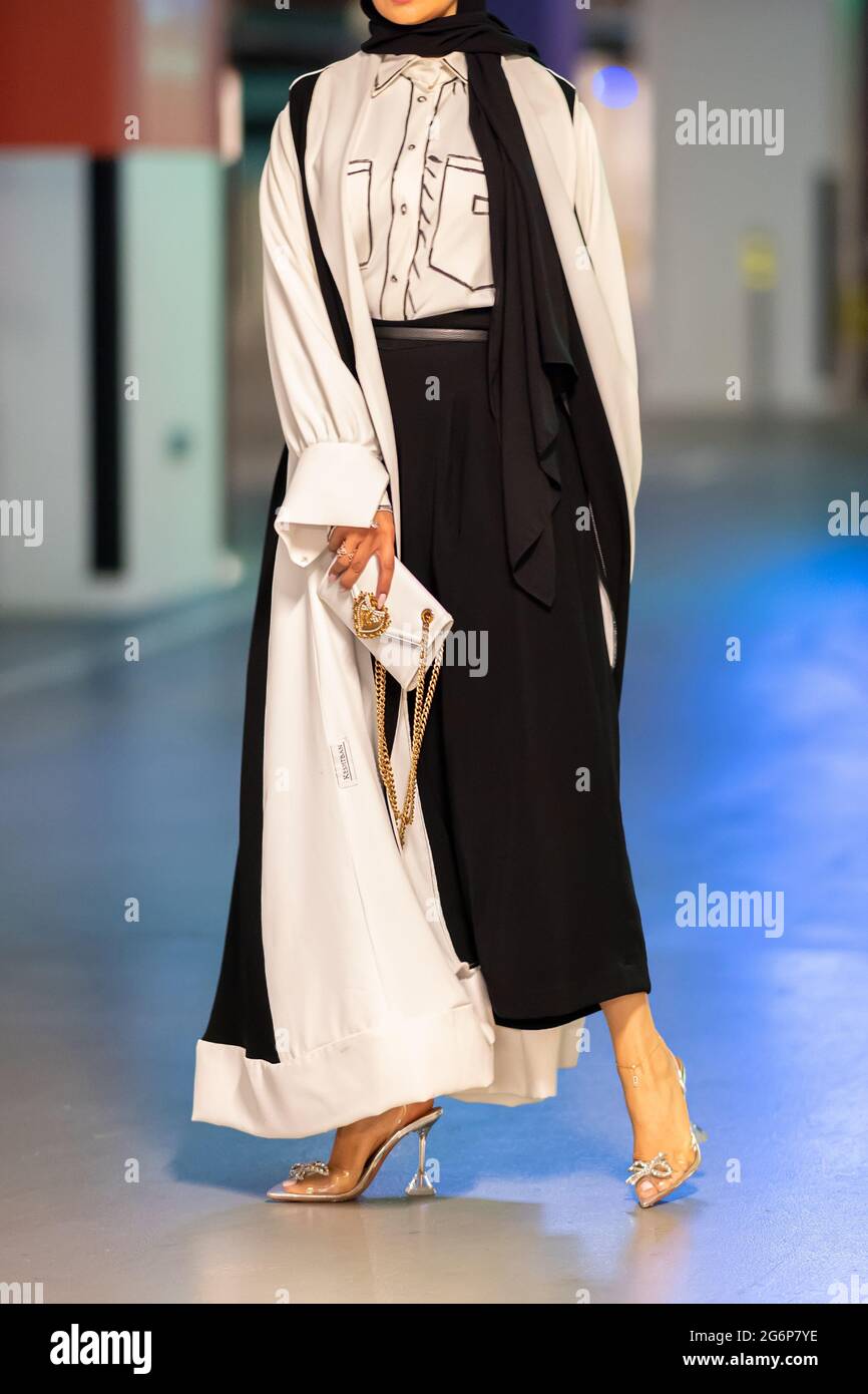 Girl in traditional Abaya in street. No Face Stock Photo