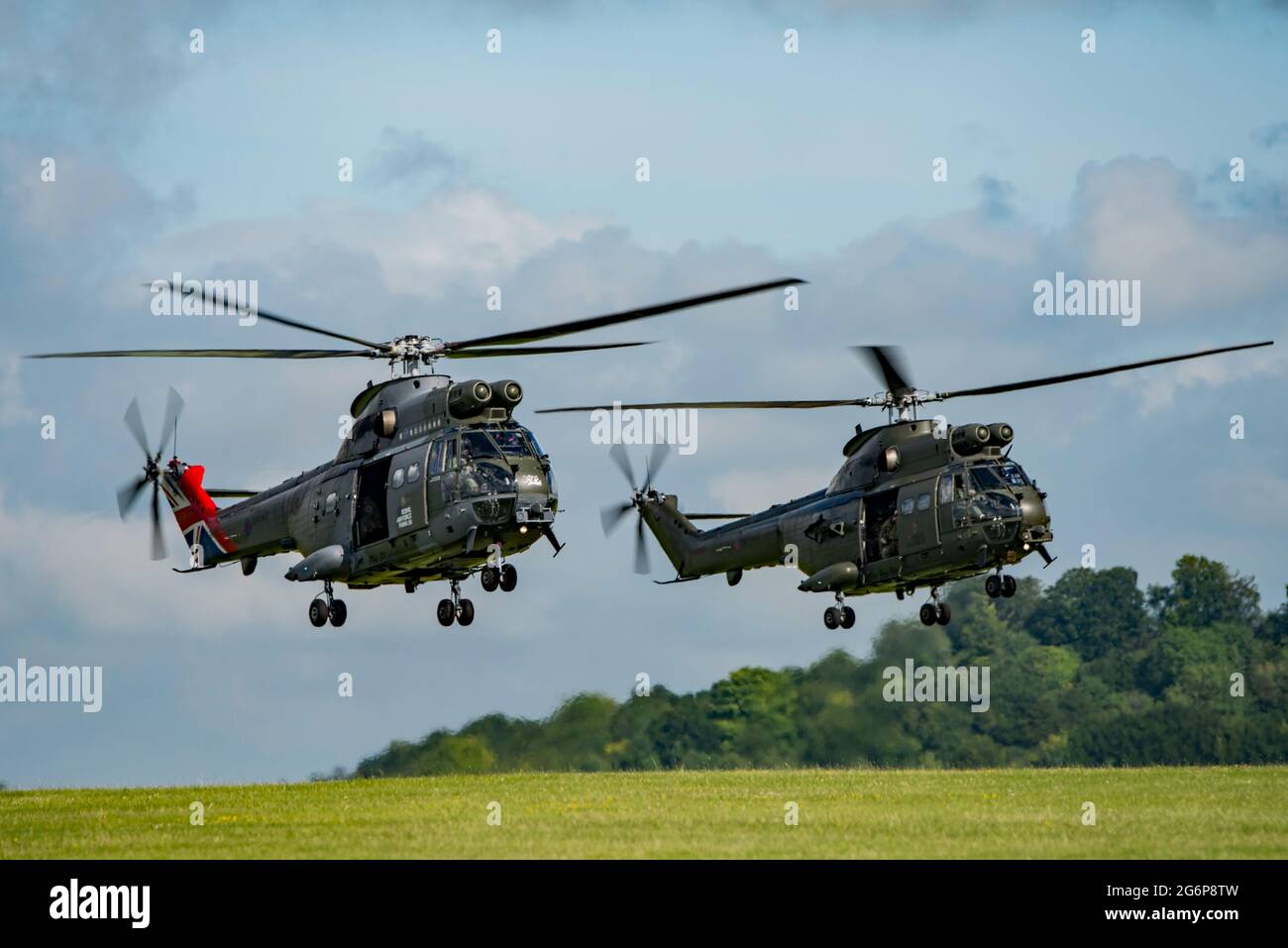 Aircraft from the RAF Puma helicopter force 50th Anniversary flypast lift off from AAC Middle Wallop, Hants on the 7th July 2021. Stock Photo