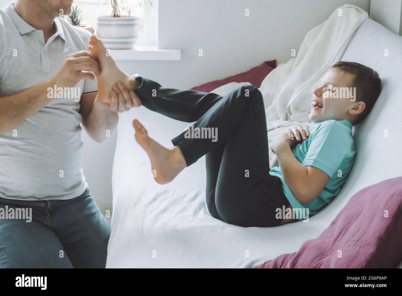 Tickling boy feet hires stock photography and images Alamy