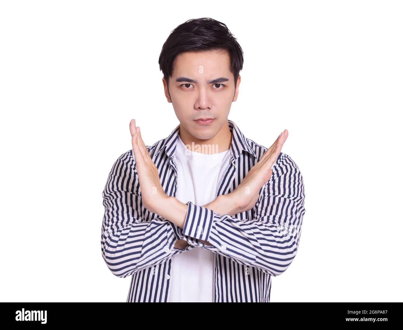Young and handsome man, expressing rejection gesture, bigger than X gesture on his chest.Isolated on white background. Stock Photo