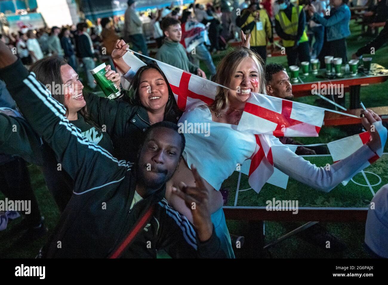London, UK. 7th July, 2021. UEFA EURO 2020: England fans celebrate in Trafalgar Square as England wins 2-1 in extra time against Denmark in the semi-finals. Credit: Guy Corbishley/Alamy Live News Stock Photo