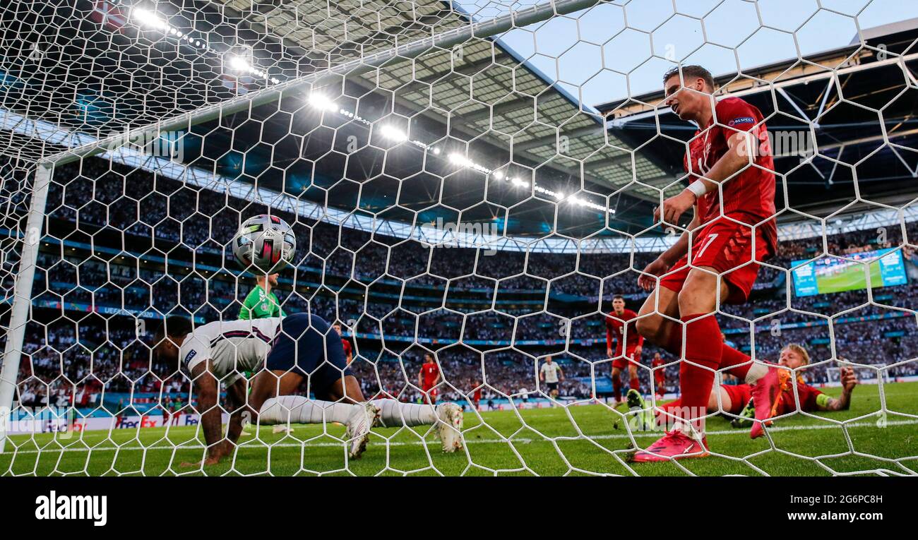 London, Britain. 7th July, 2021. Denmark's Simon Kjaer (Front, 1st R ...