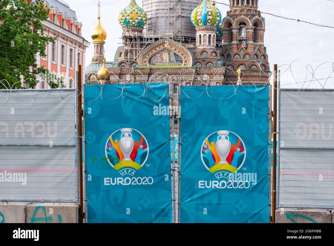 Saint Petersburg, Russia - July 7, 2021: an auxiliary entrance of a fan zone Football Village, with UEFA Euro 2020 logos and the barbed wire. Stock Photo