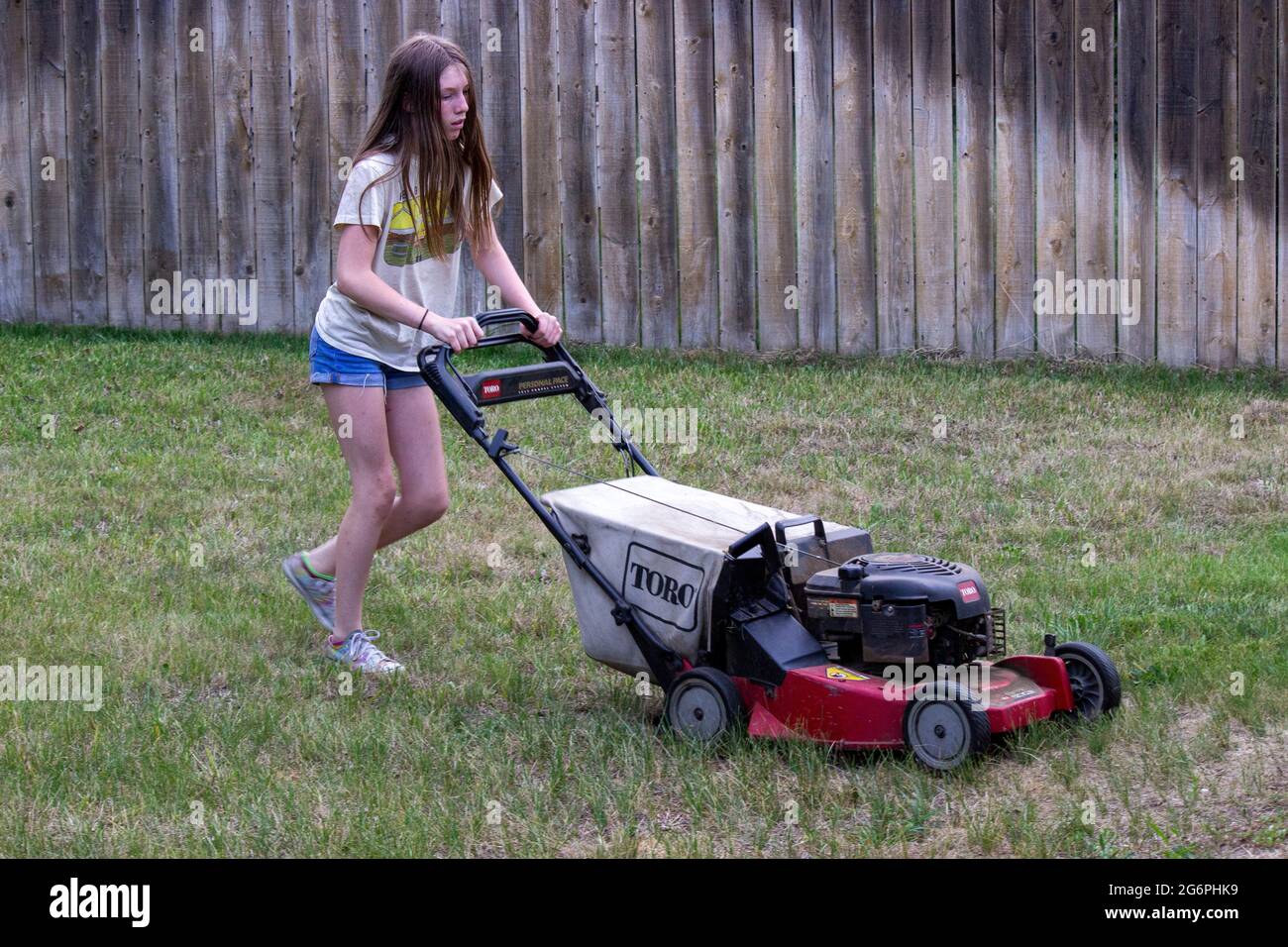 A groundskeeper mowing with a large toro mower Stock Photo - Alamy
