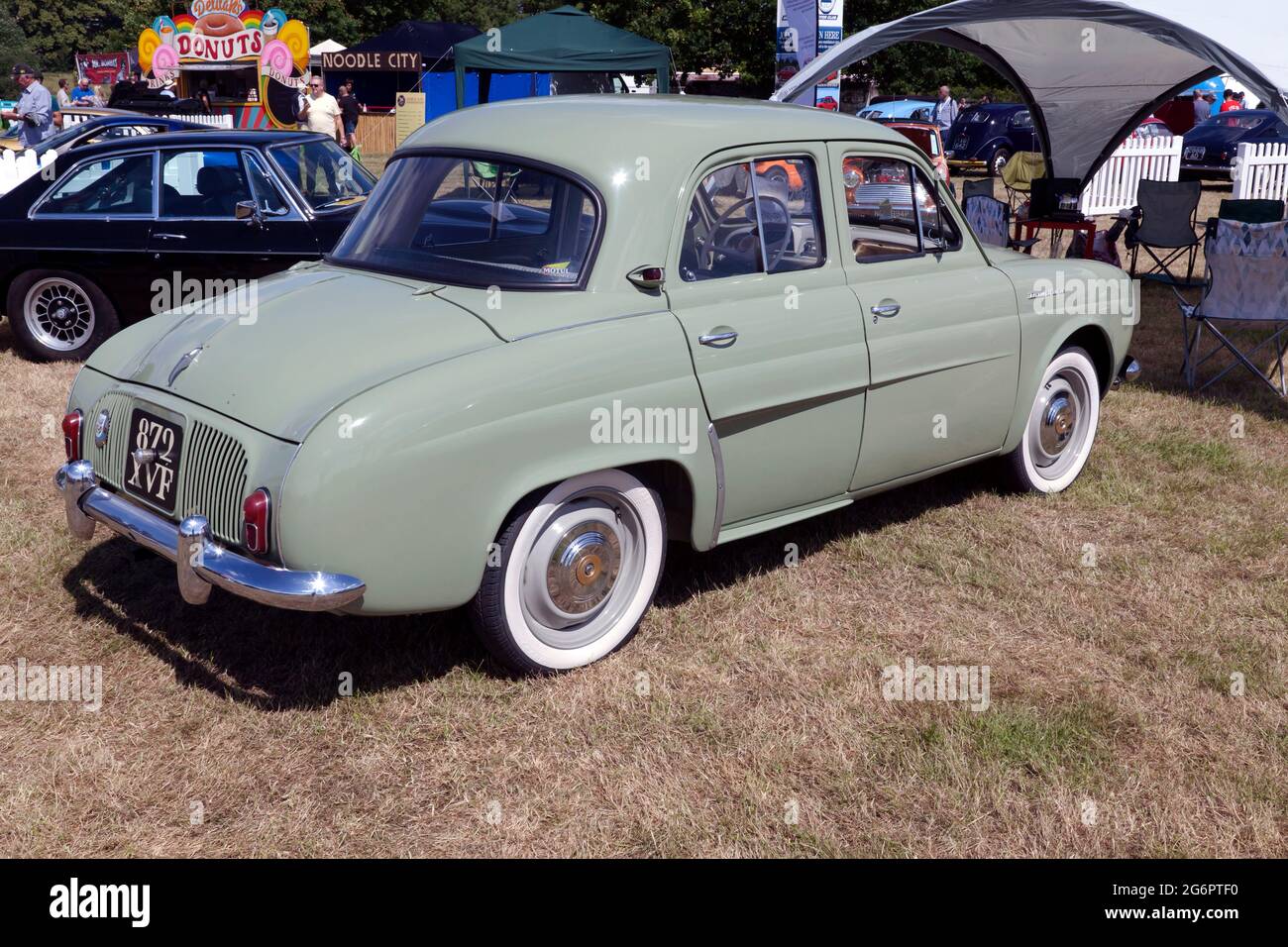 Three-quarters rear view of a Green, 1957, Renault  Dauphine, on display at the 2021  London Classic Car Show Stock Photo
