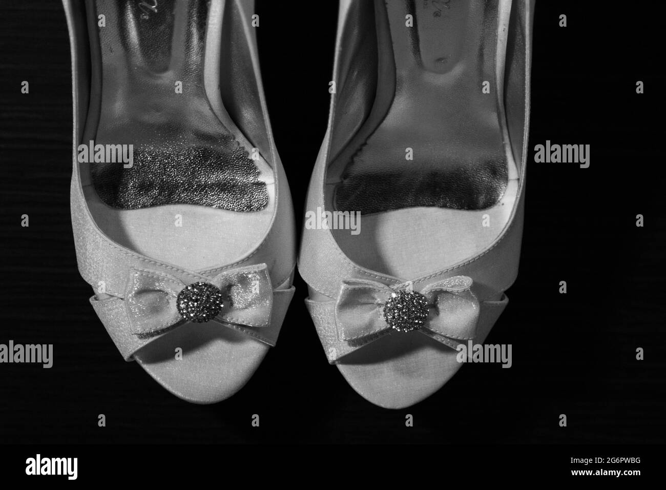 Grayscale shot of old bride shoes Stock Photo - Alamy