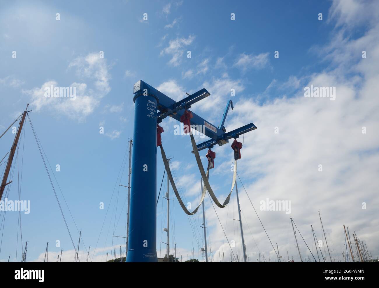 Tall static power crane for lifting boats Stock Photo Alamy