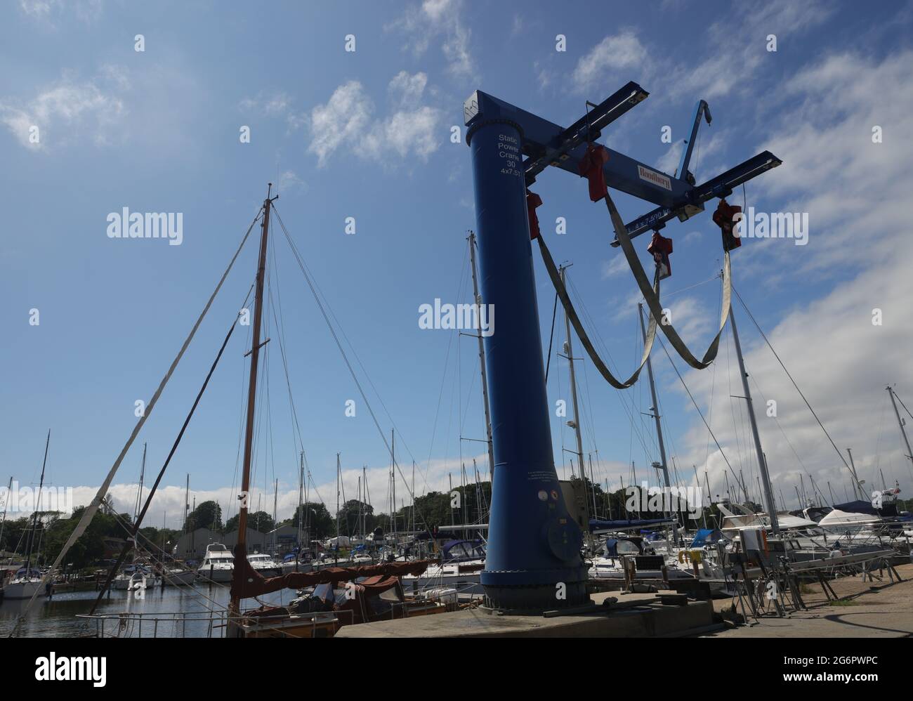 Tall static power crane for lifting boats Stock Photo Alamy