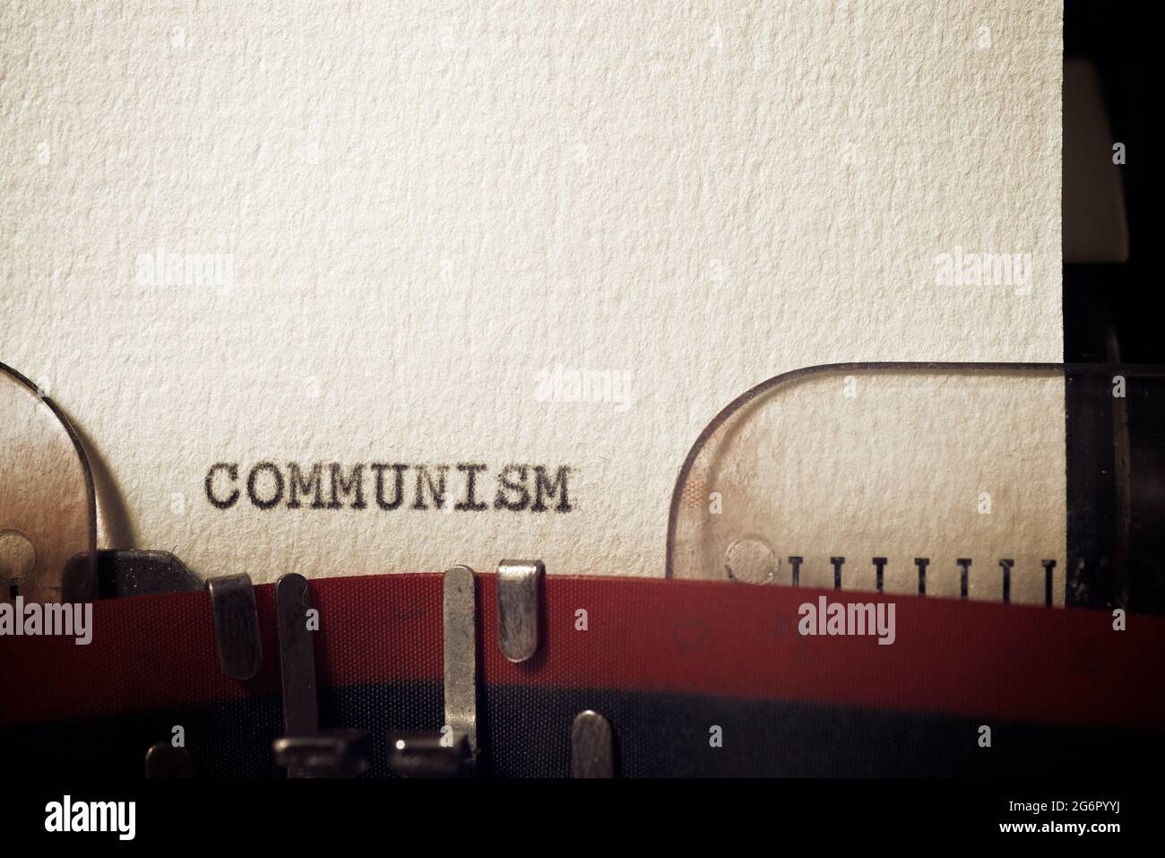 The word communism written with a typewriter. Stock Photo