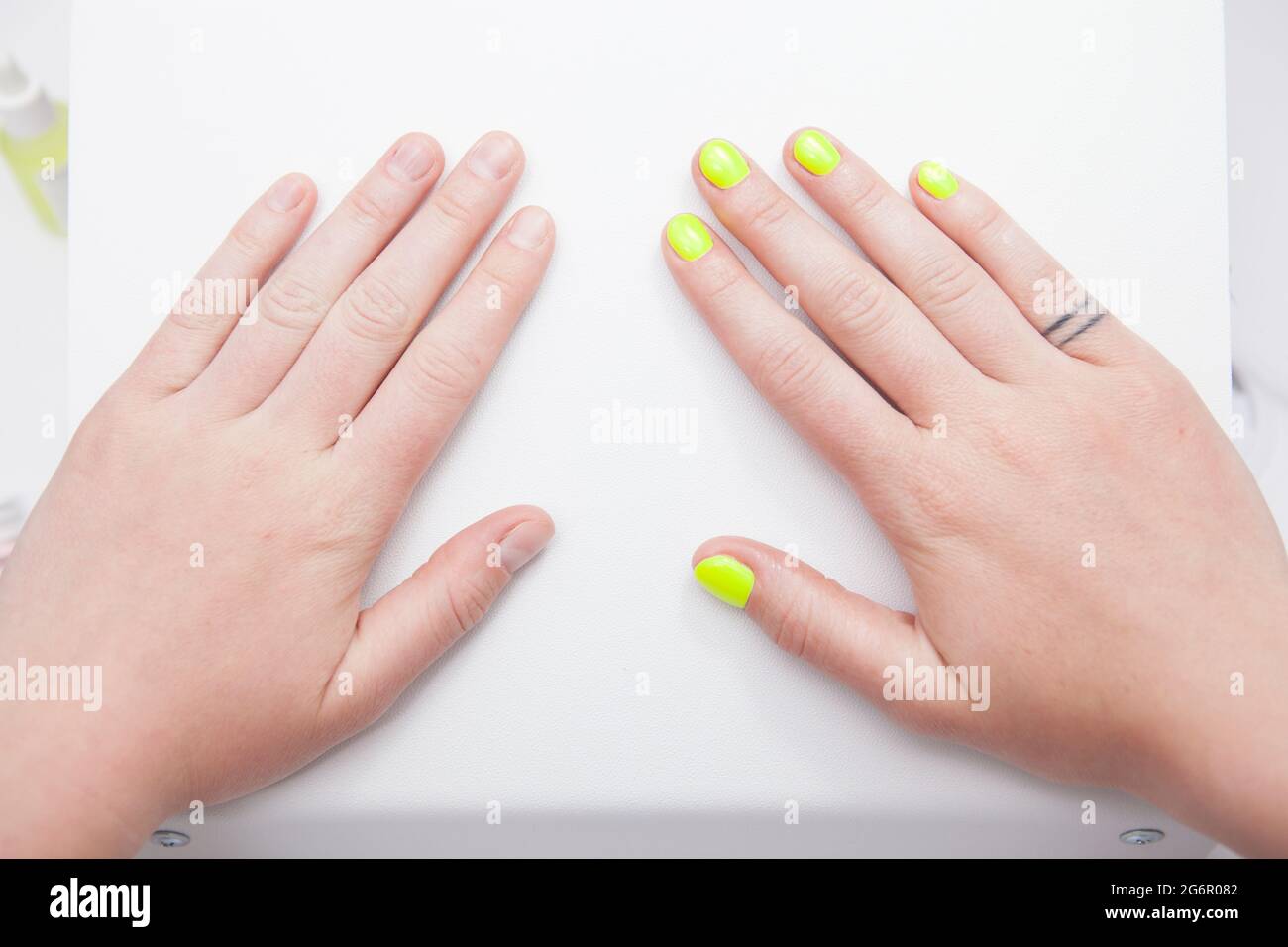 Close up of female hands before and after manicure Stock Photo Alamy