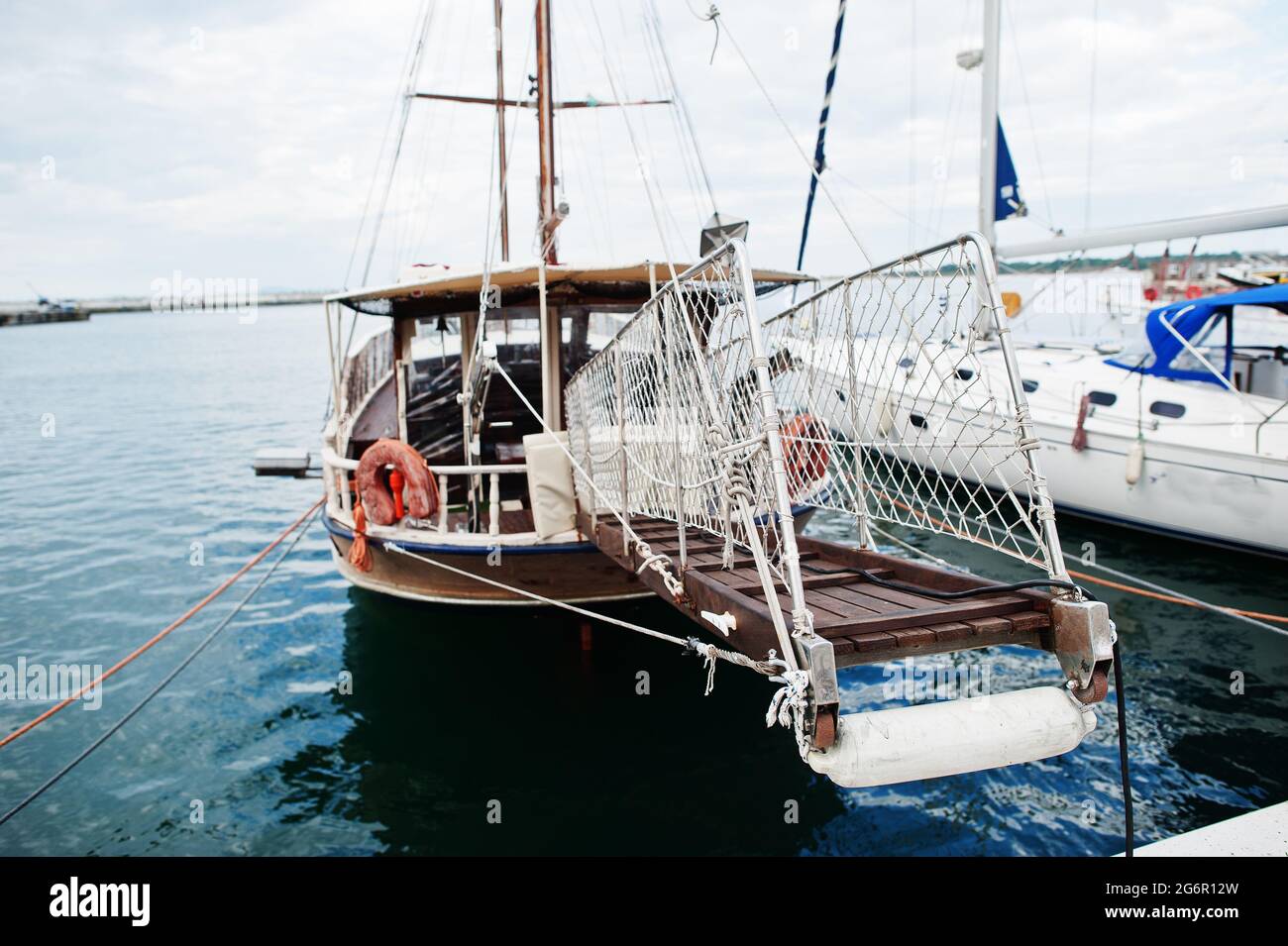 Wooden old sailing ship stay on dock Stock Photo - Alamy