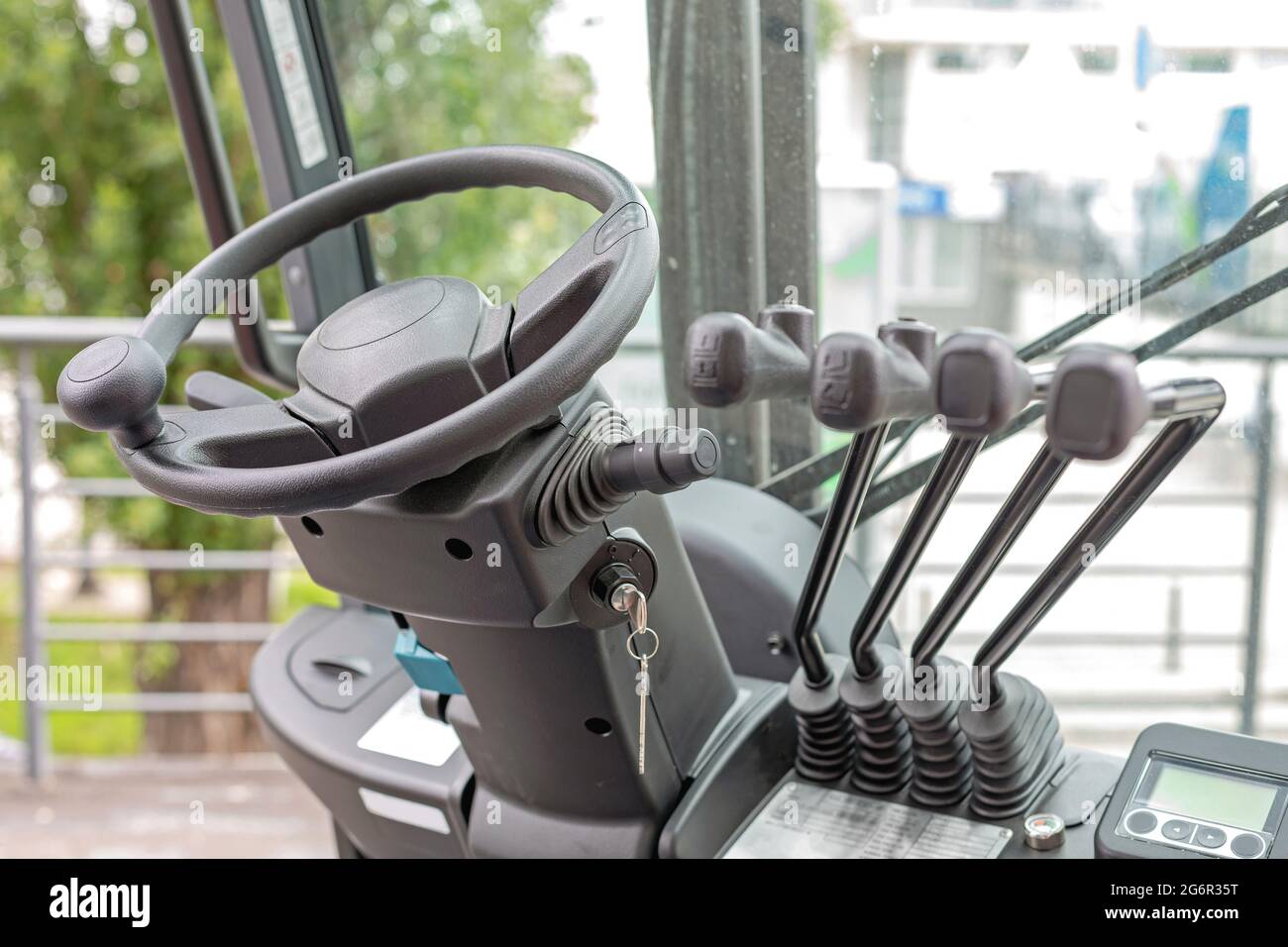 Forklift Truck Steering Wheel and Levers Commands in Cabin Stock Photo
