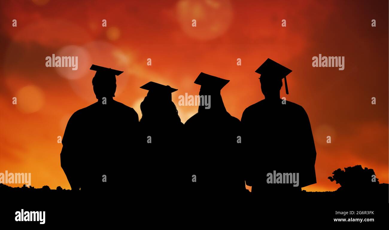 Composition of silhouettes of graduating students in caps and gowns against sunset sky Stock Photo