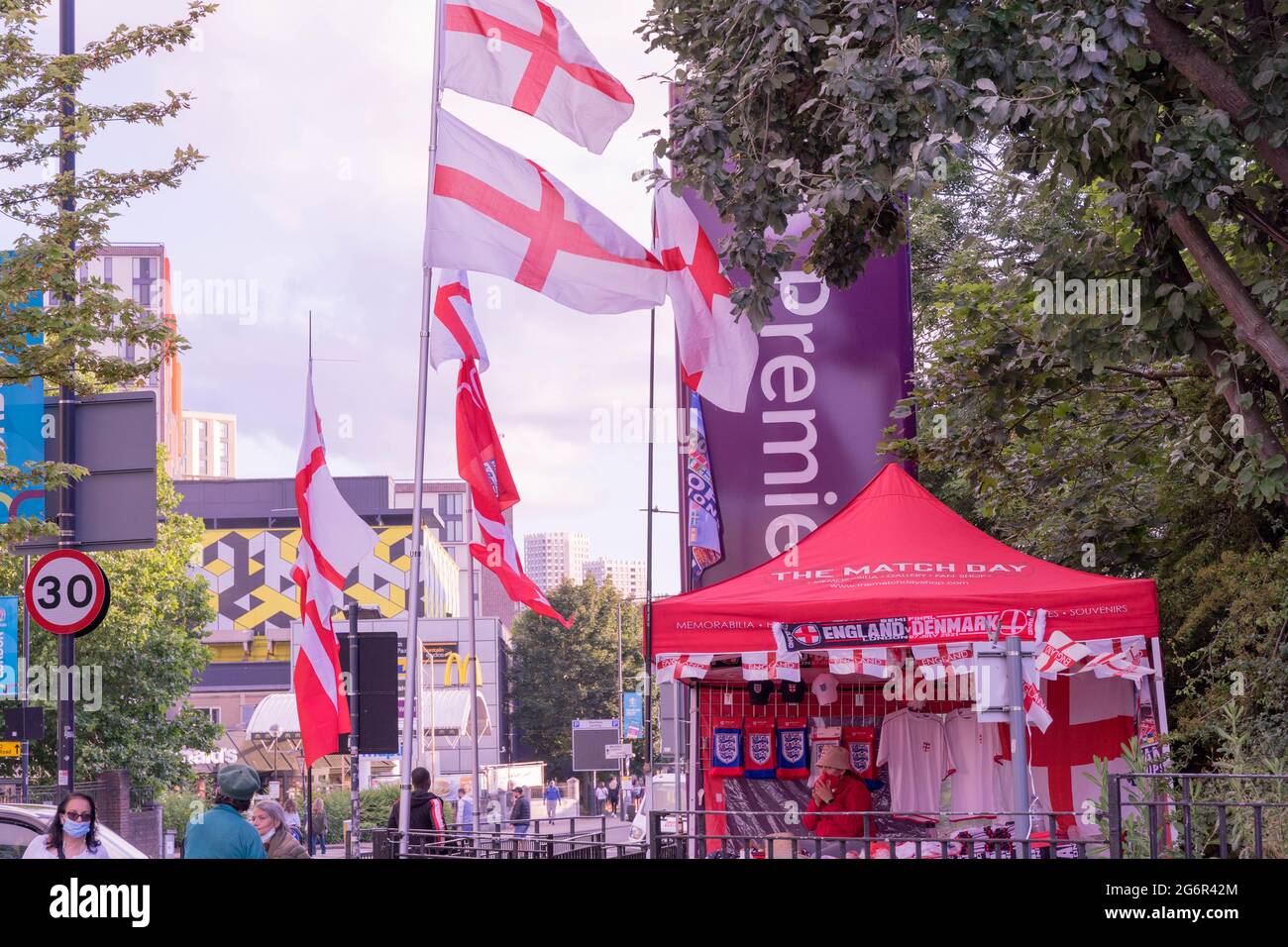 England flags flying high on street Wembley, London, England Stock