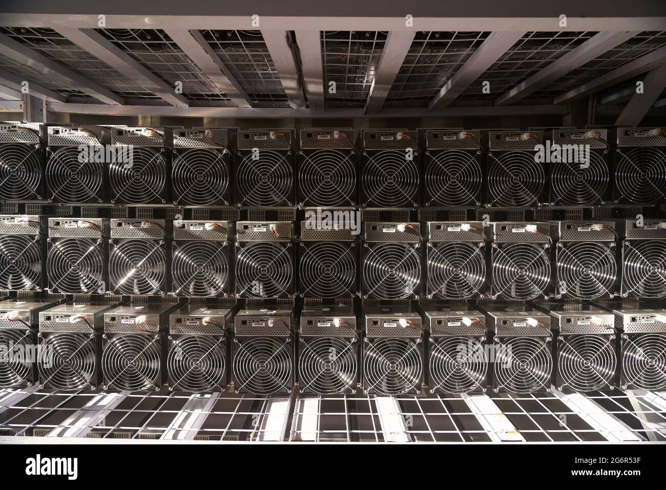 Bitcoin ASIC miners in warehouse. ASIC mining equipment on stand racks for  mining cryptocurrency in steel container. Blockchain techology application  Stock Photo - Alamy