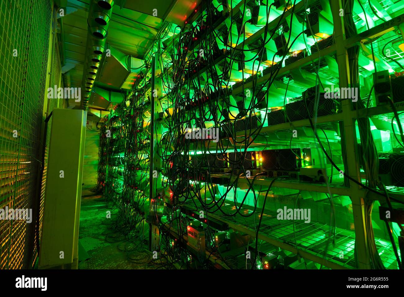 Bitcoin miners in large farm. ASIC mining equipment on stand racks mine  cryptocurrency in steel container. Blockchain techology application  specific Stock Photo - Alamy