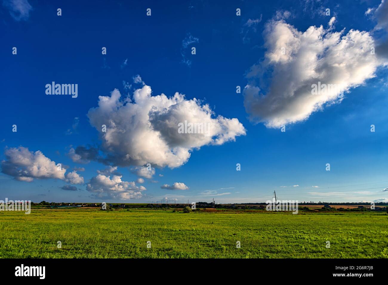 Summer landscape green meadow on the background of blue sky with white ...