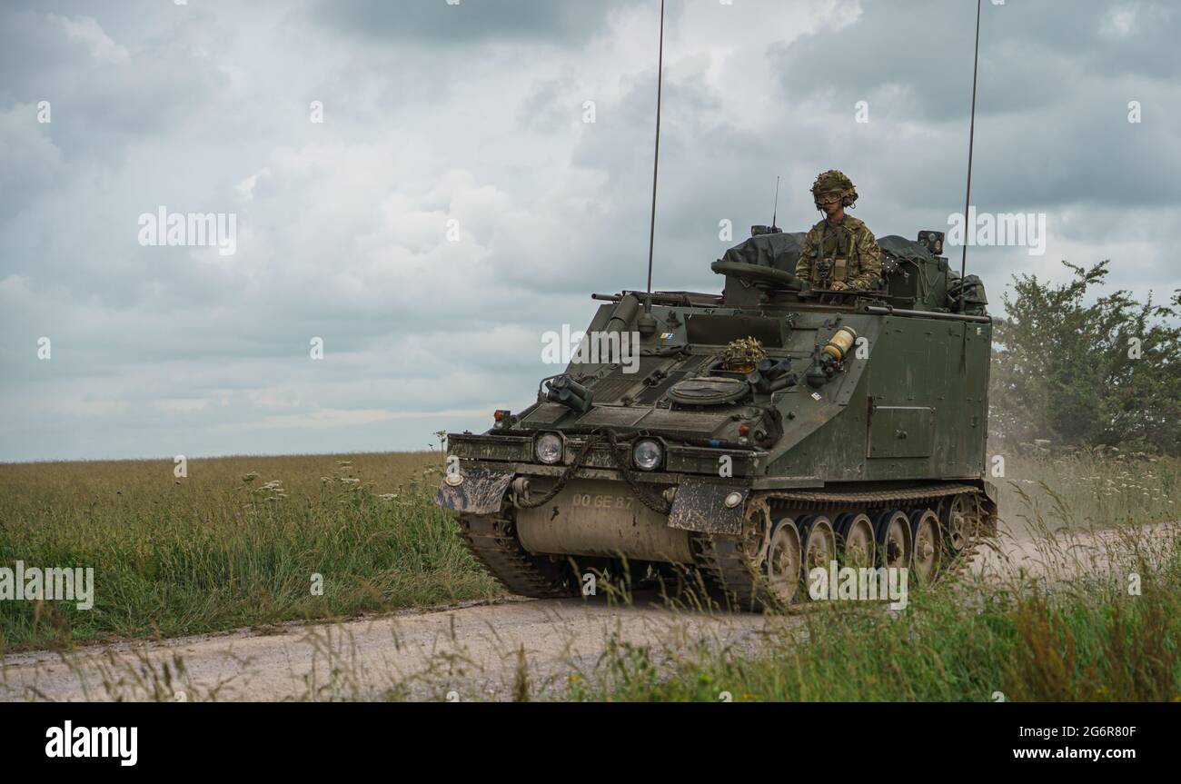British army CVRT FV105 Sultan command and control vehicle in action on Salisbury Plain, UK Stock Photo