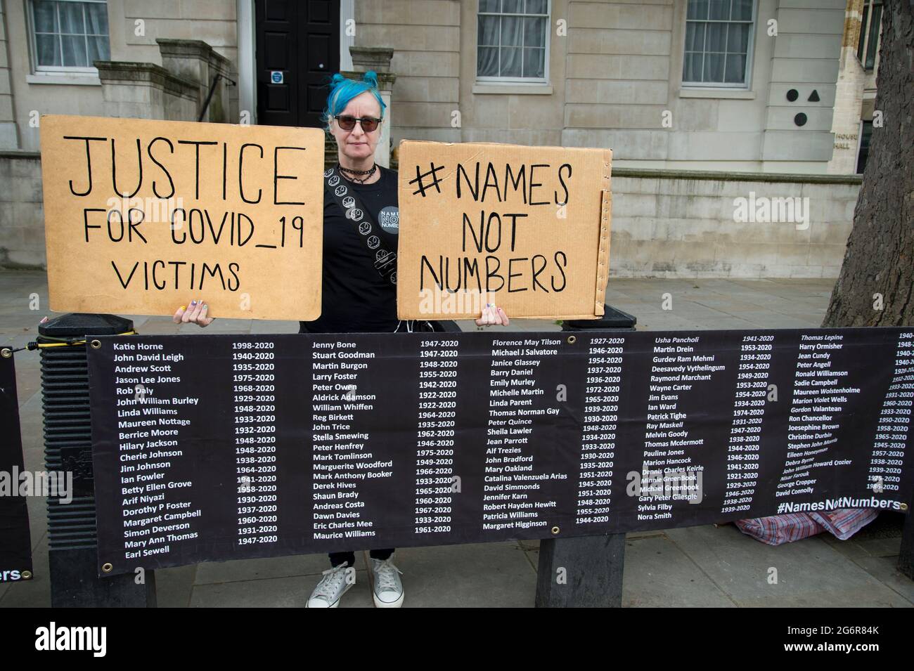 Sue, one of the first members of 'Justice for Covid 19 victims, after the death of her father from Covid, protests in front of Downing Street with the Stock Photo