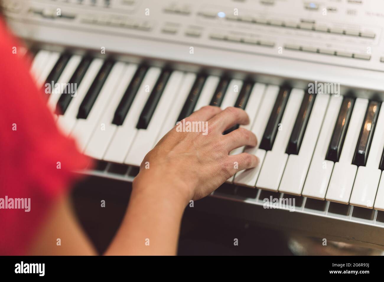 Hands of woman playing electronic piano Stock Photo Alamy