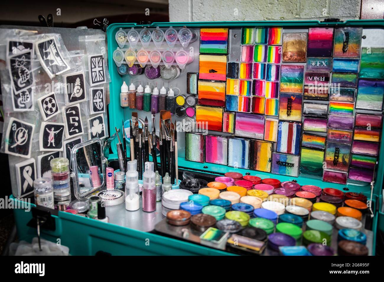 close up of paints, stencils, brushes and other equipment used for face painting. Stock Photo