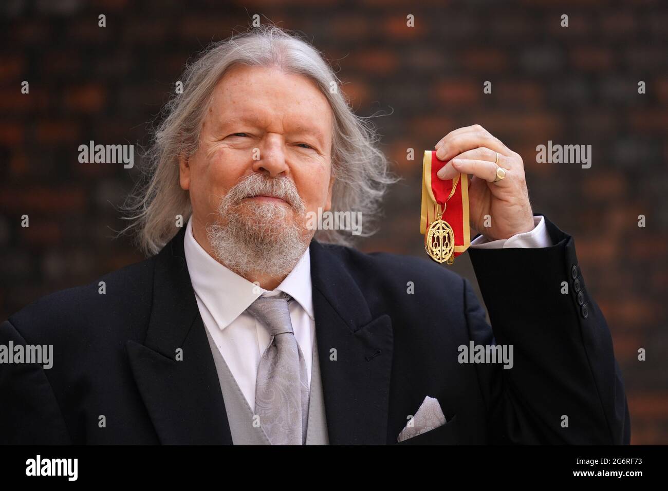 Playwright Sir Christopher Hampton after receiving a knighthood for services to drama at an investiture ceremony at St James's Palace, London. Picture date: Thursday July 8, 2021. Stock Photo