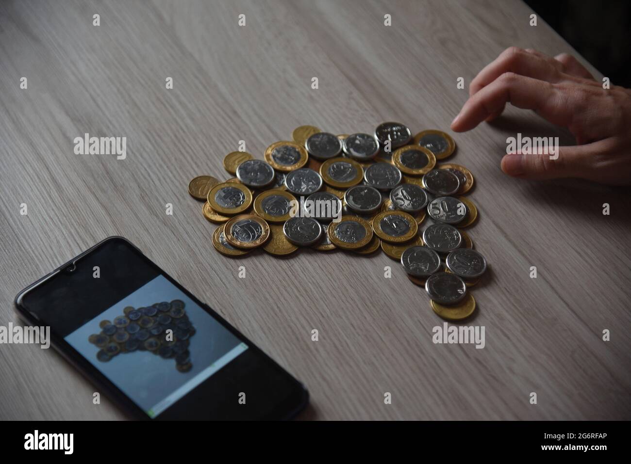 Fortaleza, Brazil. 03rd July, 2021. Map of Brazil being assembled from real and cent coins. Credit: SPP Sport Press Photo. /Alamy Live News Stock Photo