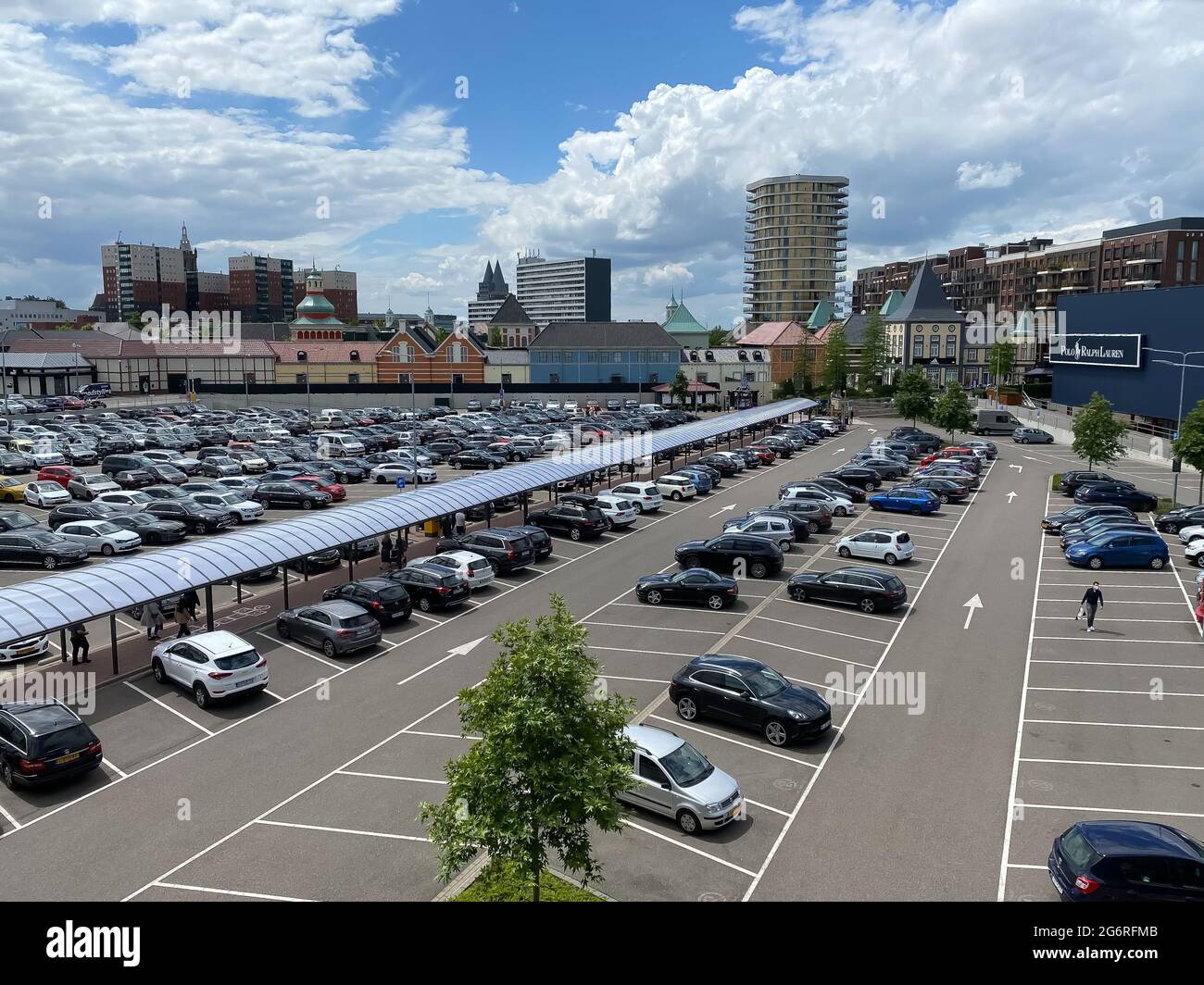 Roermond, Netherlands - July 1. 2021: Aerial view over car parking area on  buildings of designer outlet center Stock Photo - Alamy