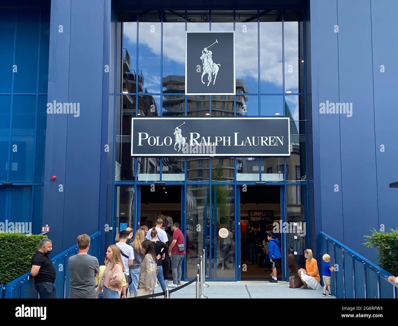 Roermond, Netherlands - July 1. 2021: View on blue facade of polo ralph  lauren fashion store with queue of people exterior of entrance Stock Photo  - Alamy