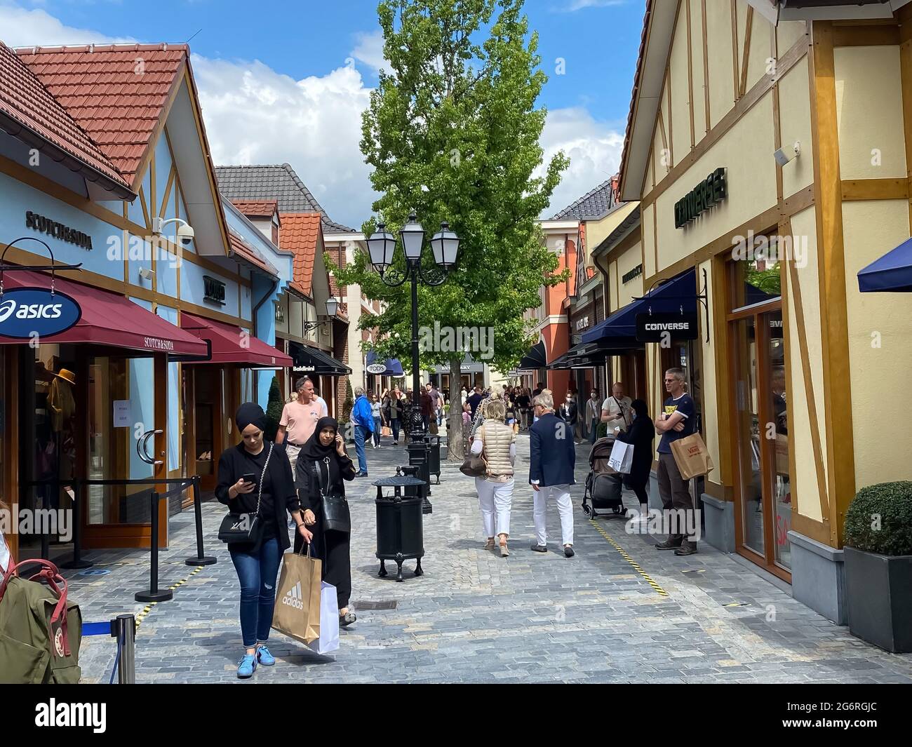 koud Marco Polo Augment Roermond (designer outlet), Netherlands - July 1. 2021: View on street with  stores and people shopping exterior in summer Stock Photo - Alamy