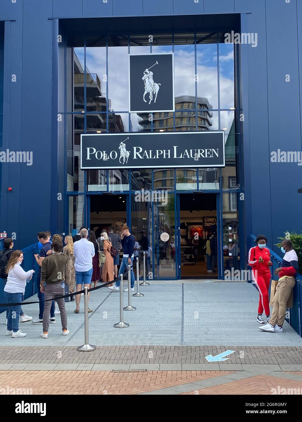 Roermond, Netherlands - July 1. 2021: View on blue facade of polo ralph  lauren fashion store with queue of people exterior of entrance Stock Photo  - Alamy