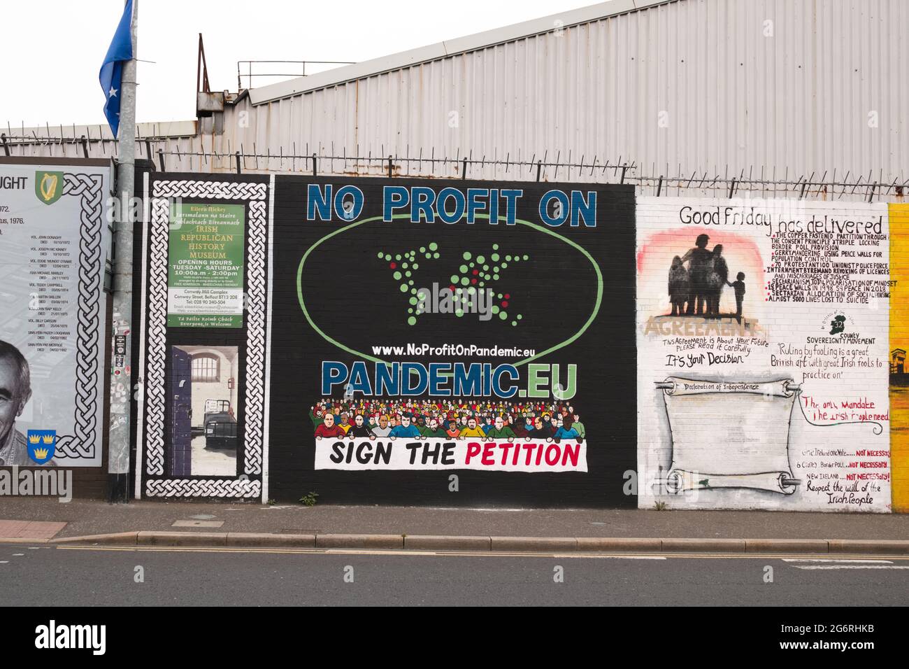 'No profit on pandemic' Murals Wall on Divis Road, Belfast, Northern Ireland. Picture date: 01 July 2021 Stock Photo