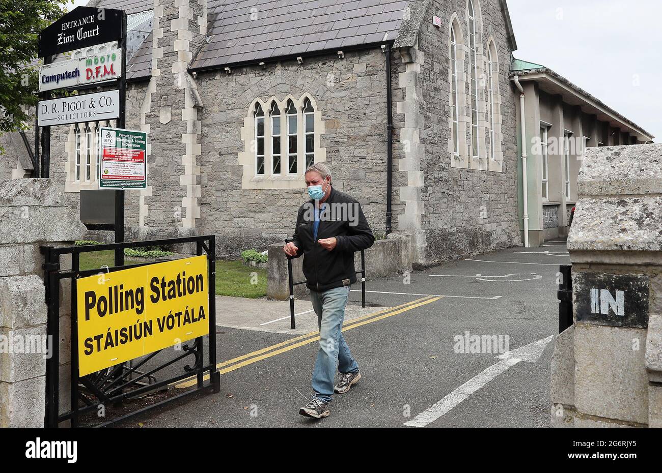 A man leaves a polling station in Rathgar, Dublin, as voting in the Dublin Bay South by-election is under way. Polls opened at 7am and will close at 10.30pm, before the count begins on Friday. Picture date: Thursday July 8, 2021. The vote follows weeks of campaigning in the race to succeed ex-Fine Gael minister Eoghan Murphy in the constituency. Stock Photo