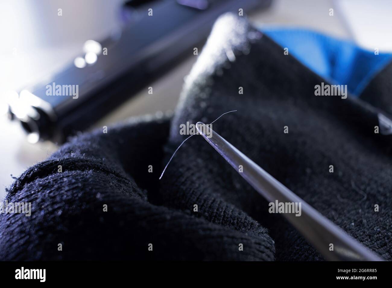 CSI police officer collects human hair samples from a tissue, police investigation concept Stock Photo