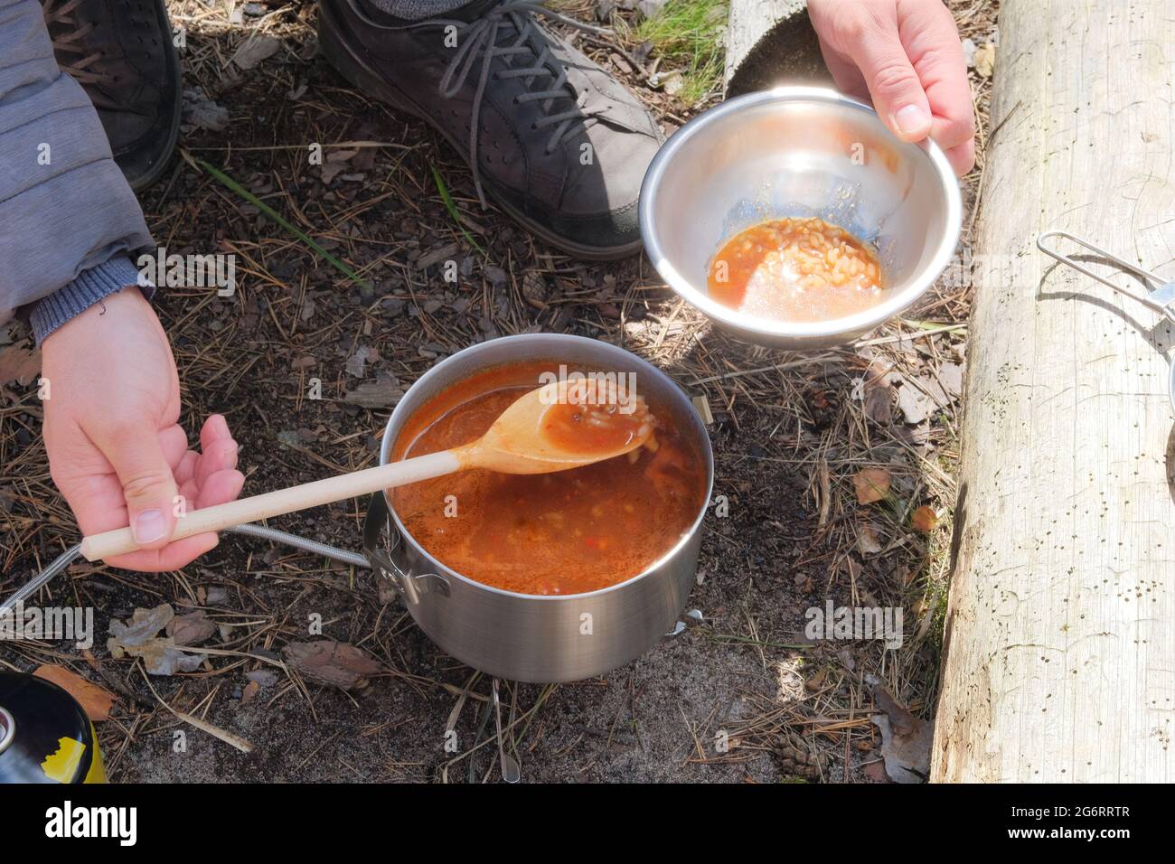Camping food making. Tourist food in outdoor activities. Soup for
