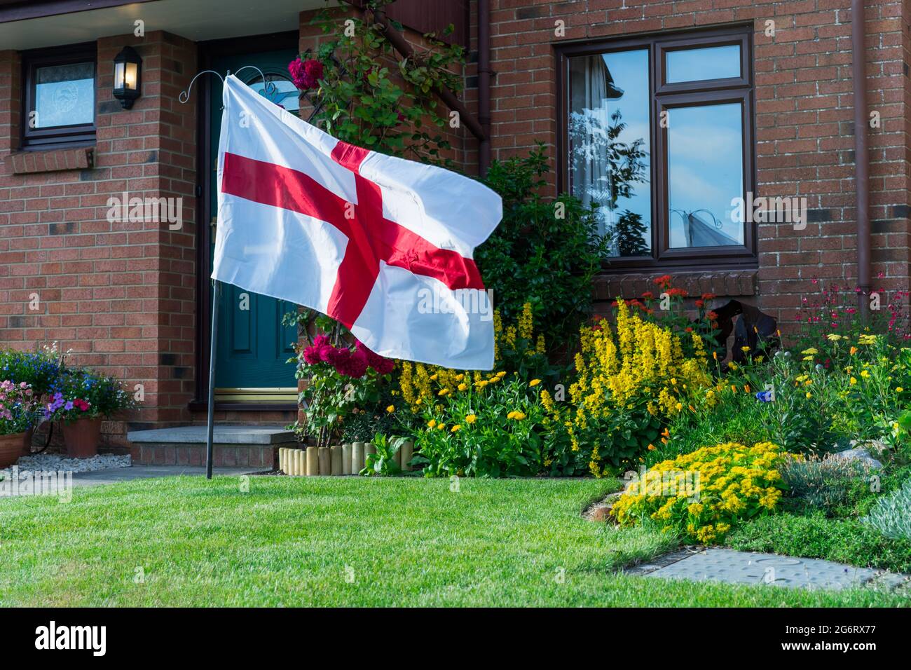 Football fans supporting England national team fan raised the flag of