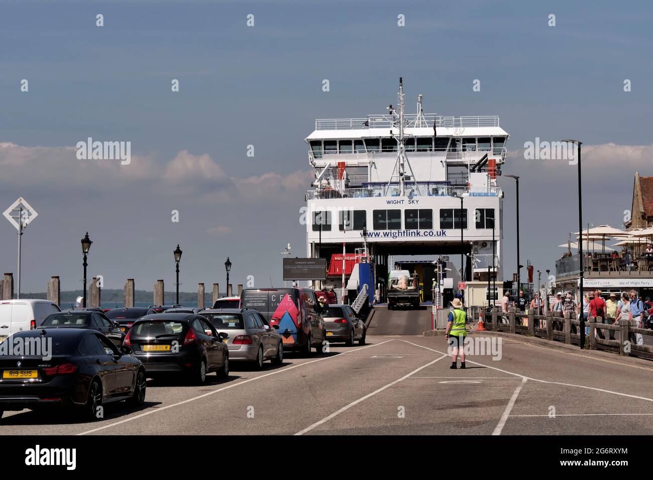 cars wait to board the Lymington ferry 'Wight Sky' at Yarmouth on the