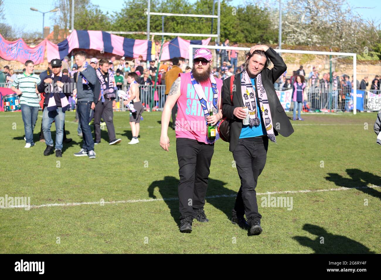 Dulwich Hamlet FC supporters on the pitch at their Champion Hill ground at East Dulwich in south east London, England, United Kingdom, Stock Photo