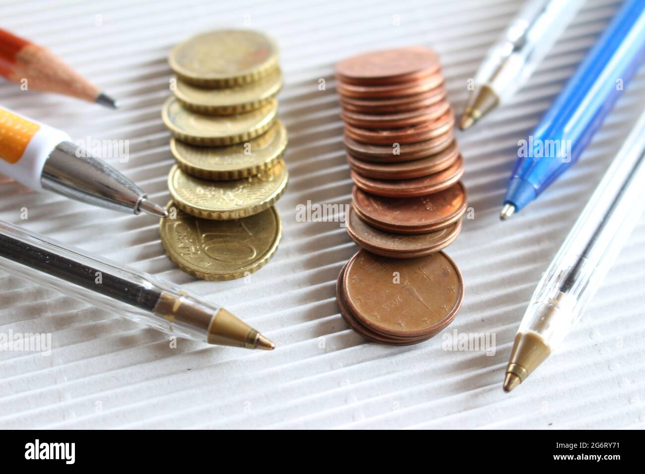 Assembly approves the financial statements. Above detail business view, pen, euro coins, on office desk, finance concept. Stock Photo