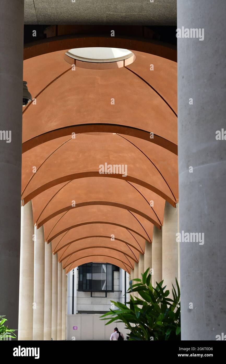 Concept of architecture symmetry design canopy roof corridor and concrete pillars Stock Photo