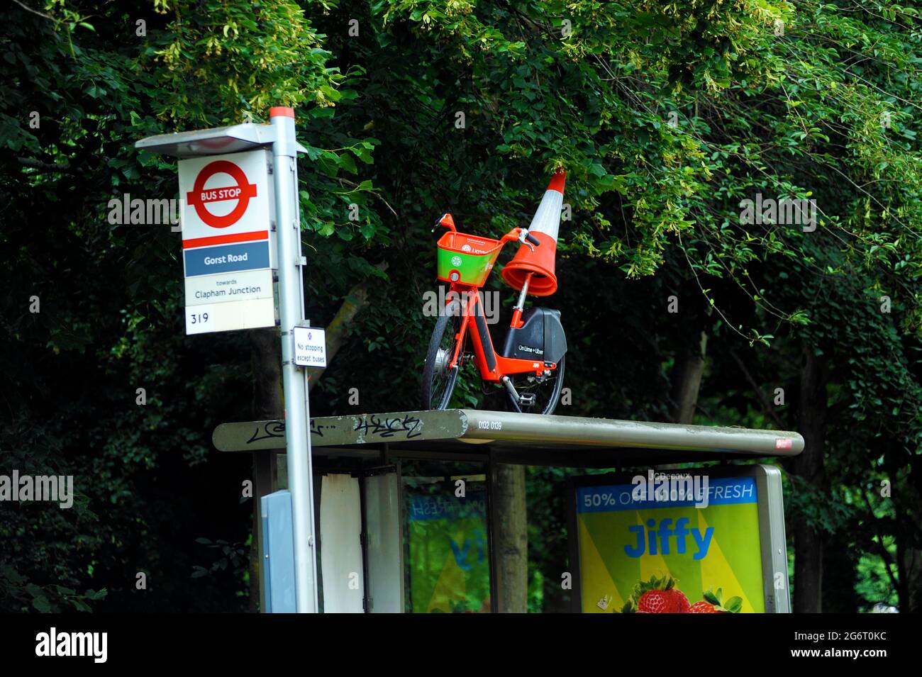 London, UK. 8th July, 2021. Lime rental Bike left on bus stand at Wandsworth Common after night of Euro football win celebrations after England beat Denmark at Wembley. Credit: JOHNNY ARMSTEAD/Alamy Live News Stock Photo