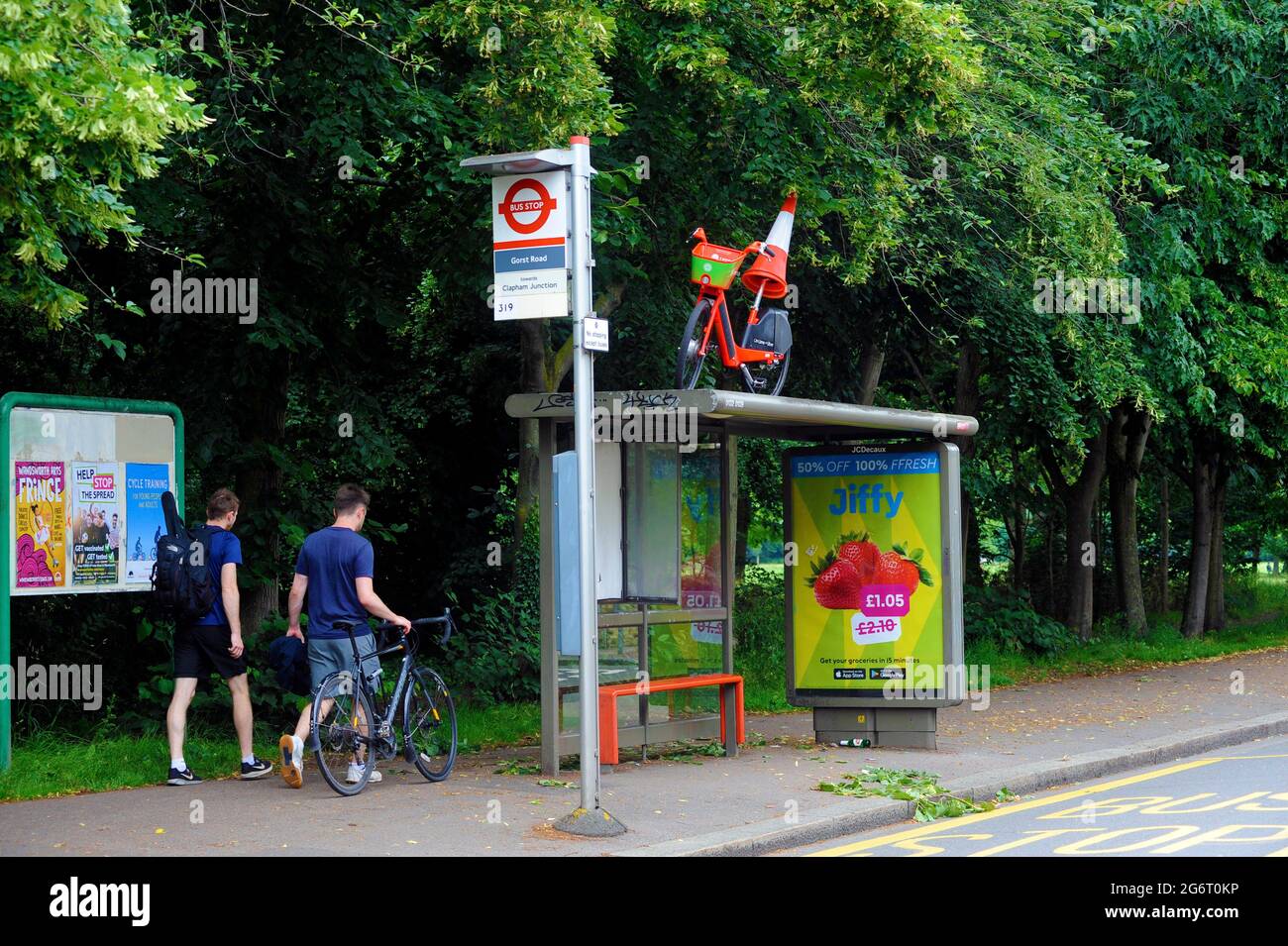 London, UK. 8th July, 2021. Lime rental Bike left on bus stand at Wandsworth Common after night of Euro football win celebrations after England beat Denmark at Wembley. Credit: JOHNNY ARMSTEAD/Alamy Live News Stock Photo