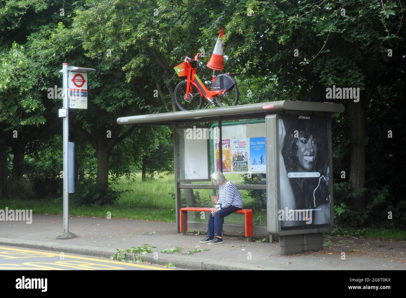 London, UK. 8th July, 2021. Lime rental Bike left on bus stand at Wandsworth Common after night of Euro football win celebrations after England beat Denmark at Wembley. Credit: JOHNNY ARMSTEAD/Alamy Live News Stock Photo